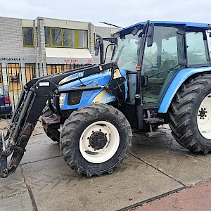New Holland TL 100 A trekker tractor met front lader boom voor